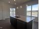A kitchen featuring a quartz countertop, an island sink, and stainless steel appliances at 273 Marvel Dr # 139, Rolesville, NC 27571