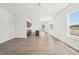 Inviting open-concept living space showcases beautiful wood floors, great natural light, and open flow to the kitchen at 273 Marvel Dr # 139, Rolesville, NC 27571
