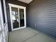 Covered outdoor patio with a sliding door entrance, perfect for relaxation and entertaining at 273 Marvel Dr # 139, Rolesville, NC 27571