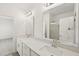 Bright bathroom featuring double sinks with quartz counters and modern lighting at 2880 Quarry Rd # 163, Rolesville, NC 27571