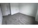 This bedroom features neutral carpet, a walk-in closet, and a light-filled atmosphere at 2880 Quarry Rd # 163, Rolesville, NC 27571