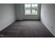 Cozy bedroom with neutral carpet, a large window, and ample natural light at 2880 Quarry Rd # 163, Rolesville, NC 27571