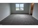 Bedroom with carpet, a large window, and access to the Primary bathroom at 2880 Quarry Rd # 163, Rolesville, NC 27571