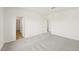 The bedroom has light carpet, white walls, and two doorways at 2880 Quarry Rd # 163, Rolesville, NC 27571