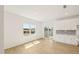 Bright dining area with light wood-look floors, white walls, and a large window overlooking the construction site at 2880 Quarry Rd # 163, Rolesville, NC 27571