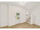 Bright entryway with hardwood floors, a staircase, and a view of the outdoors through the front door window at 2880 Quarry Rd # 163, Rolesville, NC 27571