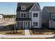 Charming two-story home with a mix of gray siding, white trim and a landscaped front yard at 2880 Quarry Rd # 163, Rolesville, NC 27571