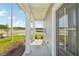 Covered front porch with classic columns offering a glimpse of a well-maintained lawn and neighborhood at 2880 Quarry Rd # 163, Rolesville, NC 27571