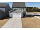 This home features a two-car garage and spacious driveway at 2880 Quarry Rd # 163, Rolesville, NC 27571