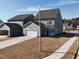 New home with attached garage and driveway, complemented by fresh landscaping at 2880 Quarry Rd # 163, Rolesville, NC 27571