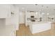 New kitchen with an island, light wood floors, recessed lighting, and stainless steel appliances at 2880 Quarry Rd # 163, Rolesville, NC 27571