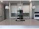 Modern kitchen featuring white cabinets, quartz countertops, and stainless steel appliances at 2880 Quarry Rd # 163, Rolesville, NC 27571