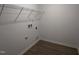 Utility room with white walls, wire shelving, and hookups for washer and dryer at 2880 Quarry Rd # 163, Rolesville, NC 27571