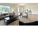 Bright living room featuring modern furniture, a decorative rug, and large windows at 2880 Quarry Rd # 163, Rolesville, NC 27571