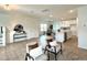 Spacious living area with a view of the modern kitchen, dining area, and staircase at 2880 Quarry Rd # 163, Rolesville, NC 27571