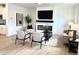 Contemporary living room with a fireplace, mounted television, and neutral-toned furnishings at 2880 Quarry Rd # 163, Rolesville, NC 27571
