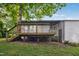 Exterior of home featuring a back deck, stairs, siding, and lawn at 292 Cedar Lake Rd # A, Chapel Hill, NC 27516