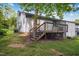 Exterior of home featuring a back deck, stairs, siding, and lawn at 292 Cedar Lake Rd # A, Chapel Hill, NC 27516