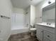 Clean bathroom with tub and shower combination and white vanity with sink at 292 Cedar Lake Rd # A, Chapel Hill, NC 27516