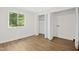 Bedroom with a window and closet with folding doors, offering lots of storage at 292 Cedar Lake Rd # A, Chapel Hill, NC 27516