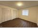 Comfortable bedroom with wood-look floors, window, and closet at 292 Cedar Lake Rd # A, Chapel Hill, NC 27516