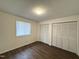 Cozy bedroom with wood-look floors, window, and closet at 292 Cedar Lake Rd # A, Chapel Hill, NC 27516