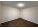 Bedroom featuring wood-look floors, neutral walls, and a door to the hall at 292 Cedar Lake Rd # A, Chapel Hill, NC 27516