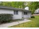 Quaint single-story house featuring light gray horizontal siding and updated windows trimmed in gray at 292 Cedar Lake Rd # A, Chapel Hill, NC 27516