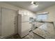Bright kitchen featuring white appliances, granite countertops, and ample cabinet space at 292 Cedar Lake Rd # A, Chapel Hill, NC 27516