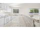 Bright kitchen features updated granite countertops and a view to the outside at 292 Cedar Lake Rd # A, Chapel Hill, NC 27516