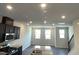 Spacious, bright kitchen featuring recessed lighting, granite counters, stainless appliances, open to the living area at 3009 Honeymyrtle Ln, Durham, NC 27703