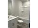 Bathroom features a vanity with white cabinets and a shower-tub combination with a white surround at 3011 Honeymyrtle Ln, Durham, NC 27703