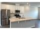 Beautiful kitchen with stainless steel appliances, quartz countertops, and an island with a sink at 3011 Honeymyrtle Ln, Durham, NC 27703
