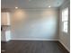 Open concept living room, offering plenty of space with hardwood floors and recessed lighting at 3011 Honeymyrtle Ln, Durham, NC 27703