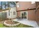 Lawn and outdoor seating area. Features concrete patio, metal chairs and table, and rock border at 308 Summerfield Crossing Road, Chapel Hill, NC 27514