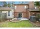Wide exterior view of backyard with seating area, grass, and landscaping at 308 Summerfield Crossing Road, Chapel Hill, NC 27514