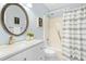 Updated bathroom features a shower-tub combo and a modern vanity with stylish fixtures at 308 Summerfield Crossing Road, Chapel Hill, NC 27514