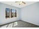 Light-filled bedroom with a large window overlooking the yard at 308 Summerfield Crossing Road, Chapel Hill, NC 27514