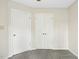 Bedroom featuring neutral paint and gray carpeting, along with ample closet space at 308 Summerfield Crossing Road, Chapel Hill, NC 27514