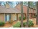 Inviting home exterior with neutral siding, a cozy entrance, and mature landscaping at 308 Summerfield Crossing Road, Chapel Hill, NC 27514