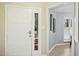 Bright foyer with natural light, white door with glass detail, and tile flooring at 308 Summerfield Crossing Road, Chapel Hill, NC 27514