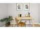 Simple home office with sleek wooden desk, artwork, and decorative accents at 308 Summerfield Crossing Road, Chapel Hill, NC 27514