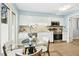 Bright eat-in kitchen features stainless steel appliances and white cabinets at 308 Summerfield Crossing Road, Chapel Hill, NC 27514