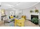 Bright living room features a cozy fireplace, stylish furniture, and neutral wall color at 308 Summerfield Crossing Road, Chapel Hill, NC 27514
