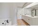 Large bathroom featuring double vanity with tile floor, soaking tub and walk in shower at 309 Neuse Ridge Dr, Clayton, NC 27527