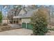 Exterior view of a large home featuring a garage, deck, and well-maintained landscaping at 309 Neuse Ridge Dr, Clayton, NC 27527