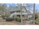 Exterior view of a house featuring a deck, garage, and mature landscaping at 309 Neuse Ridge Dr, Clayton, NC 27527