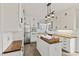 Bright kitchen featuring white cabinets, stainless steel appliances, wooden countertops, and modern pendant lighting at 309 Neuse Ridge Dr, Clayton, NC 27527