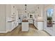 Bright kitchen featuring white cabinets, stainless steel appliances, wooden countertops, and modern pendant lighting at 309 Neuse Ridge Dr, Clayton, NC 27527
