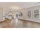 Bright, open concept living room and kitchen combination with wood floors and neutral paint at 309 Neuse Ridge Dr, Clayton, NC 27527